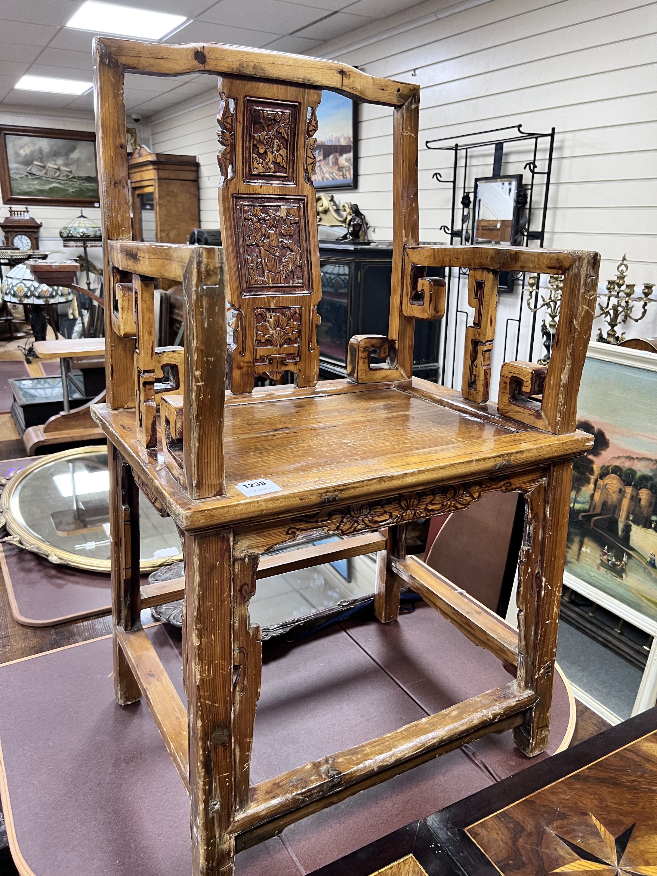 A Chinese carved pine armchair, width 57cm